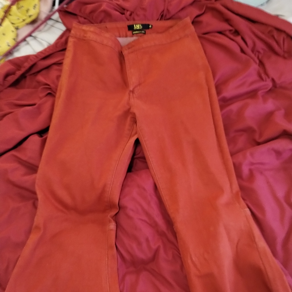 Rust colored bell bottom skinnies